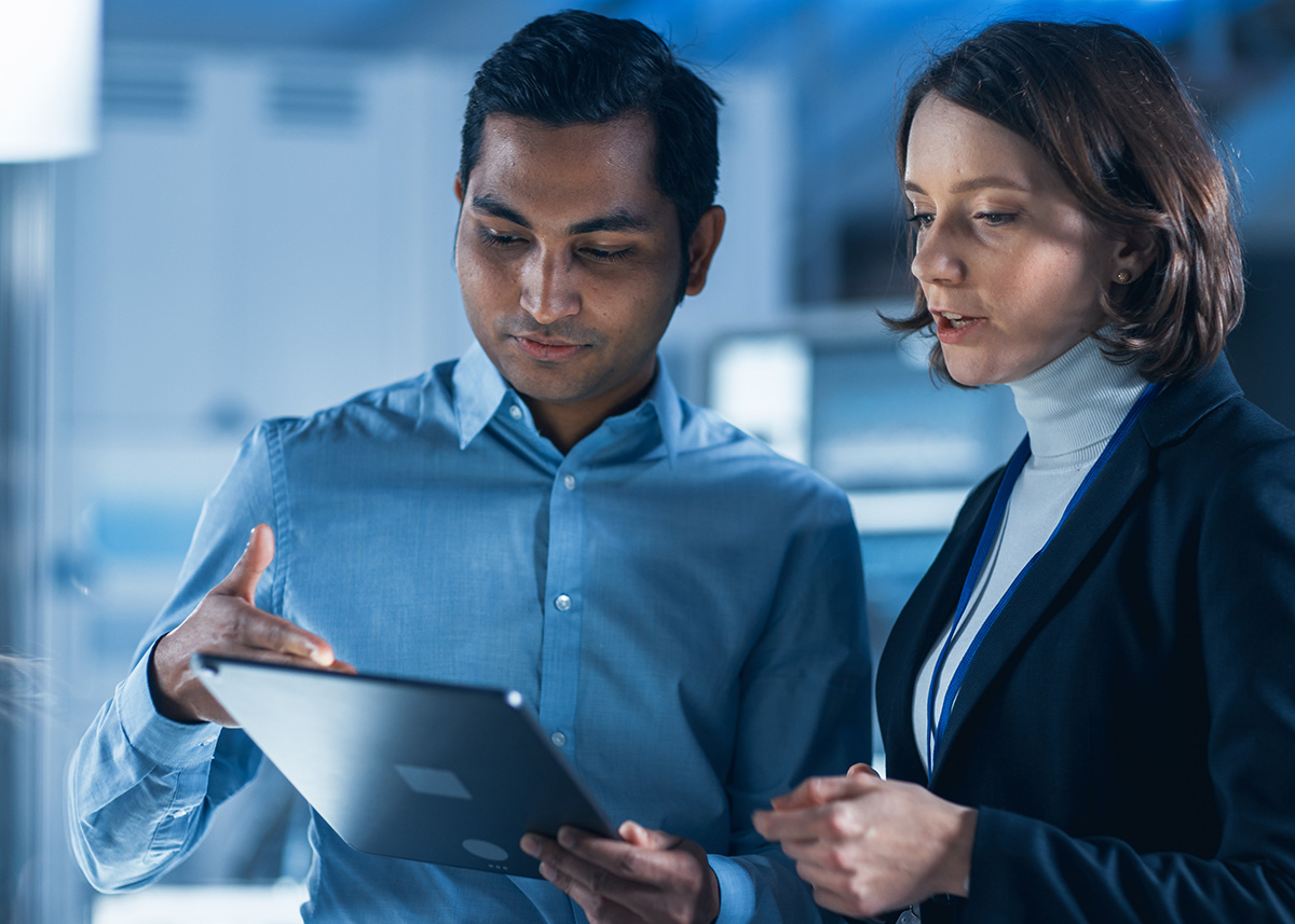 Marketing professionals reviewing strategy on a tablet