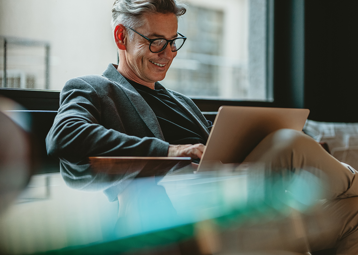 Marketing executive using a laptop to review results