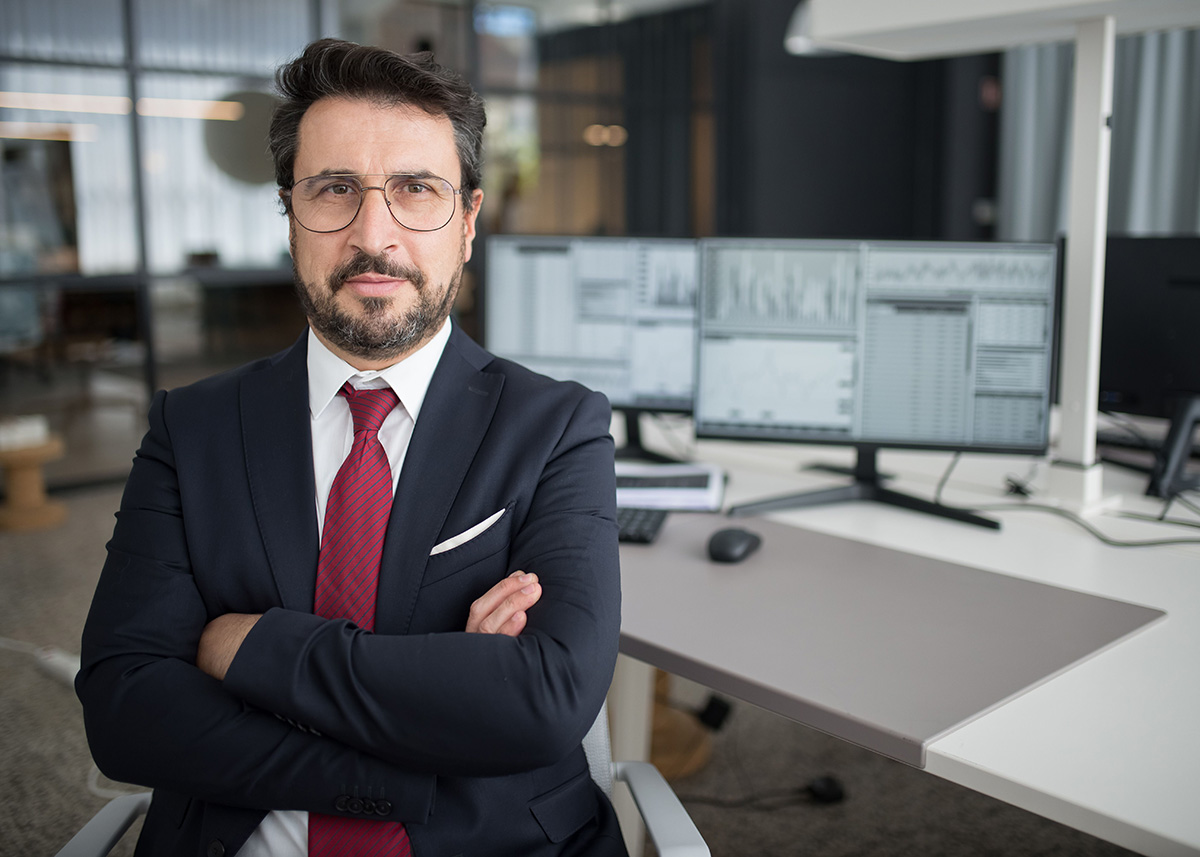 Technology marketing leader in front of campaign analytics screens