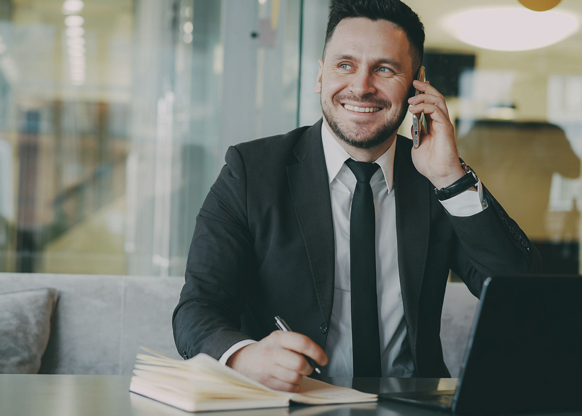 Financial services marketing leader speaking with a colleague by phone